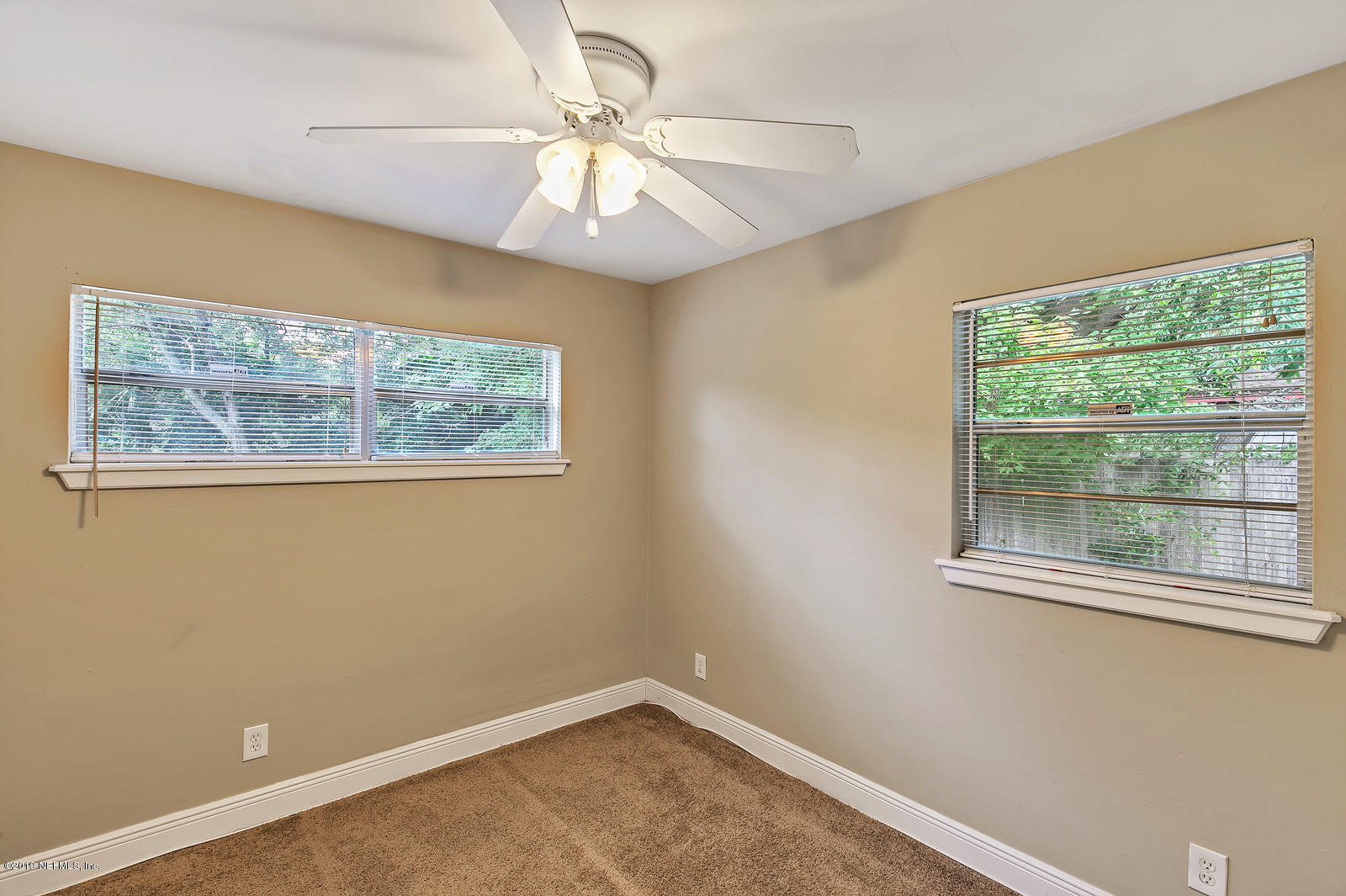 7464 Centauri Road Jacksonville, FL 32210 - Photo 13 of 15 an empty room with a window