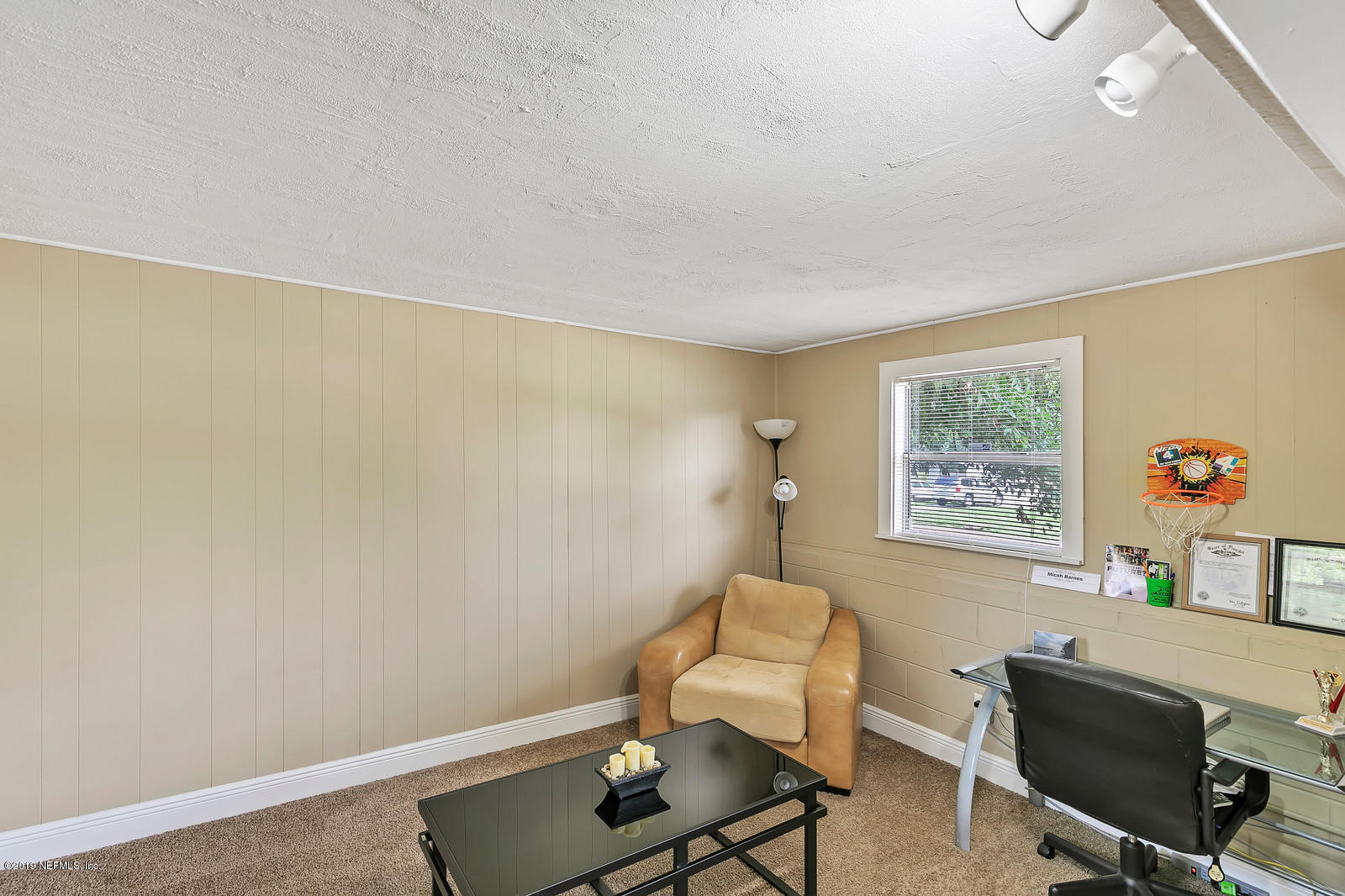 7464 Centauri Road Jacksonville, FL 32210 - Photo 9 of 15 a view of a workspace with furniture and a window