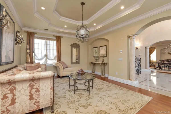 a view of a dining room and hall with furniture