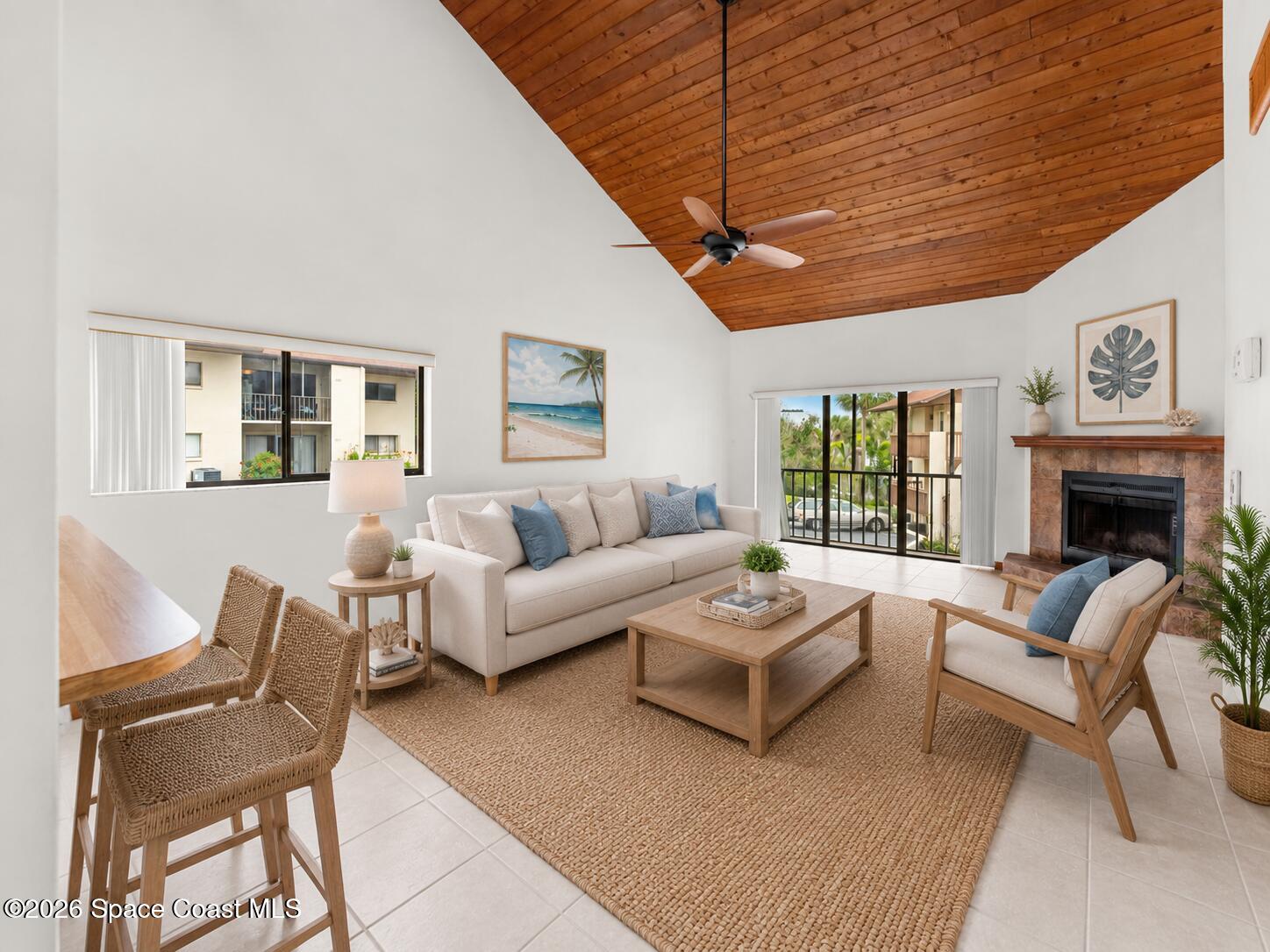 3121 Kirkland Road Northeast Palm Bay, FL 32905 - Photo 15 of 52 a living room with furniture a fireplace and a table