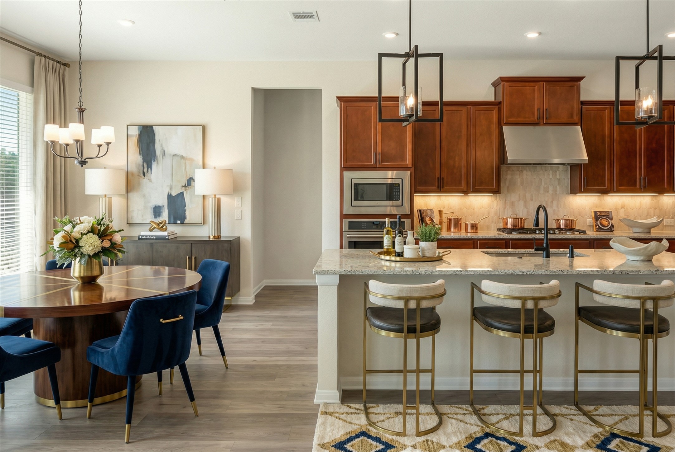 2660 Novara Trail Leander, TX 78641 - Photo 5 of 25 a kitchen with stainless steel appliances kitchen island granite countertop a dining table chairs and a refrigerator