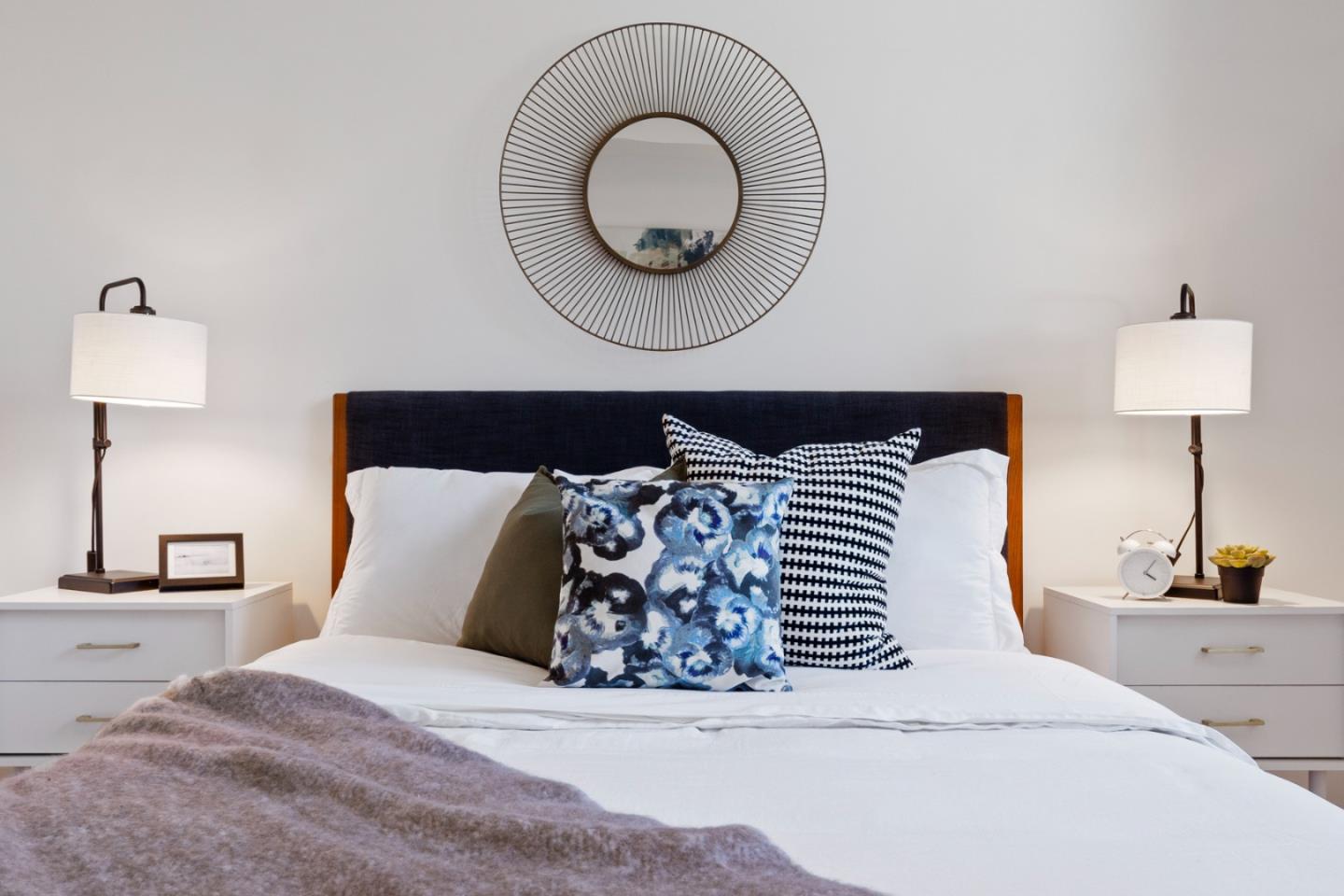 99 Rausch Street, Unit 219 San Francisco, CA 94103 - Photo 17 of 57 a bed sitting in a bedroom next to a lamp