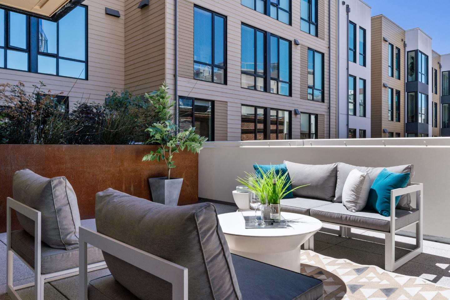 99 Rausch Street, Unit 219 San Francisco, CA 94103 - Photo 35 of 57 a view of a patio with couches table and chairs and potted plants