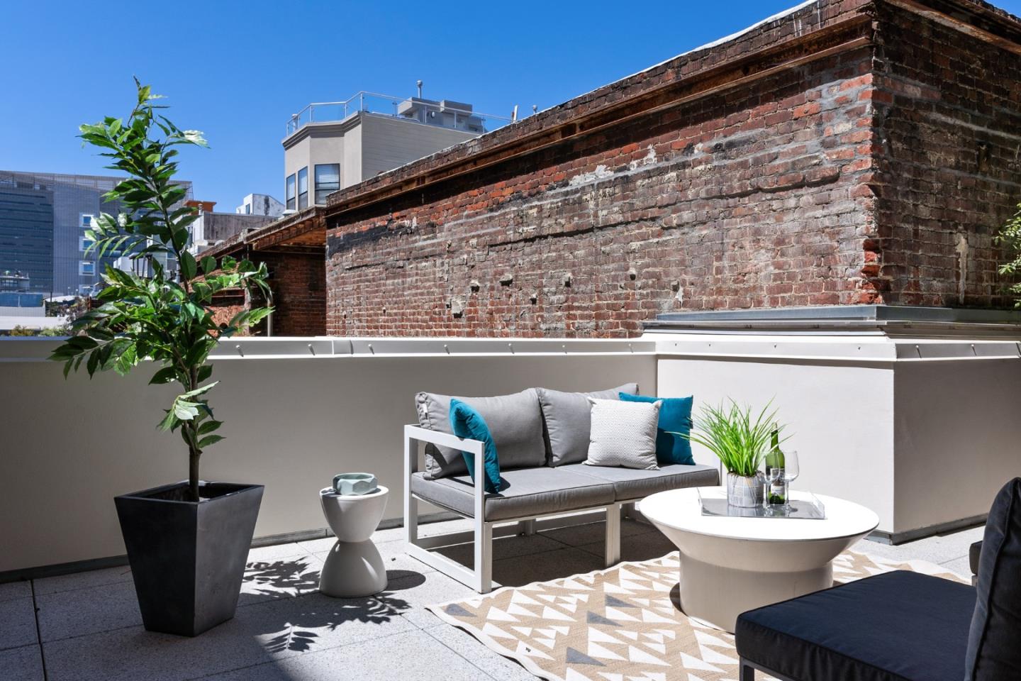 99 Rausch Street, Unit 219 San Francisco, CA 94103 - Photo 36 of 57 a view of a patio with couches and potted plants