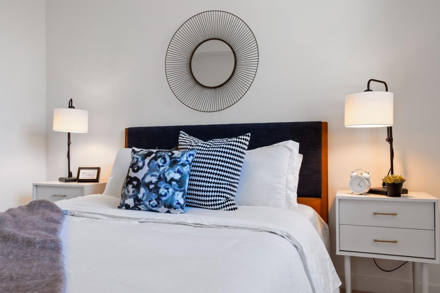 99 Rausch Street, Unit 219 San Francisco, CA 94103 - Photo 55 of 57 a bed room with a bed and a mirror