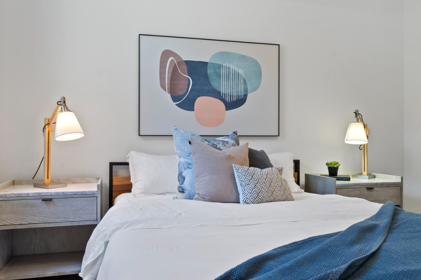 99 Rausch Street, Unit 219 San Francisco, CA 94103 - Photo 56 of 57 a bedroom with a large bed and a mirror