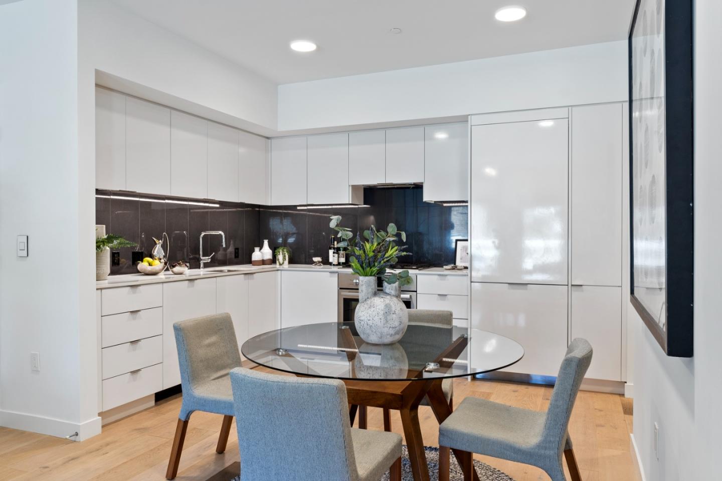 99 Rausch Street, Unit 219 San Francisco, CA 94103 - Photo 8 of 57 a kitchen with a table and chairs in it
