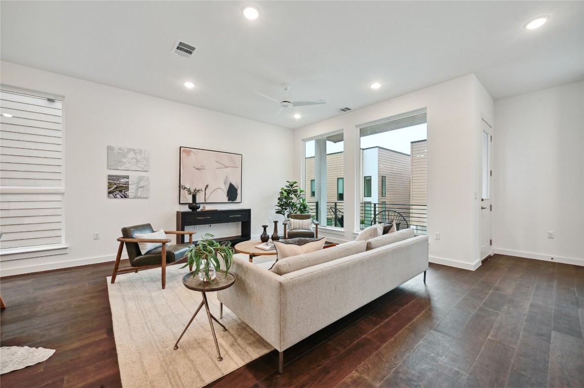 6821 Wolfcreek Pass, Unit 12 Austin, TX 78749 - Photo 11 of 32 a living room with furniture and wooden floor