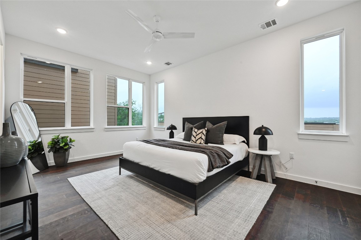 6821 Wolfcreek Pass, Unit 12 Austin, TX 78749 - Photo 22 of 32 a spacious bedroom with a bed couch and windows