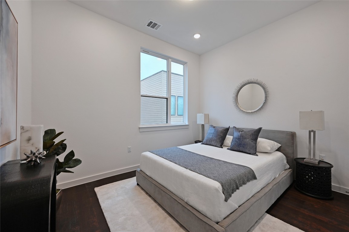 6821 Wolfcreek Pass, Unit 12 Austin, TX 78749 - Photo 26 of 32 a bedroom with a bed and a window