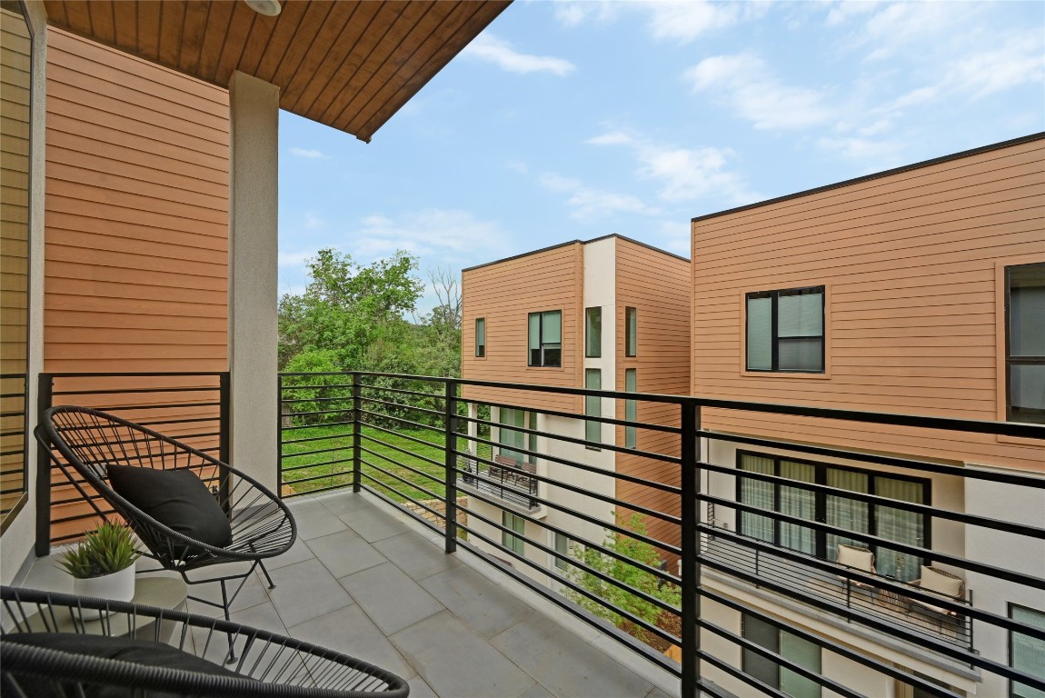 6821 Wolfcreek Pass, Unit 12 Austin, TX 78749 - Photo 28 of 32 a view of a roof deck with wooden floor and fence