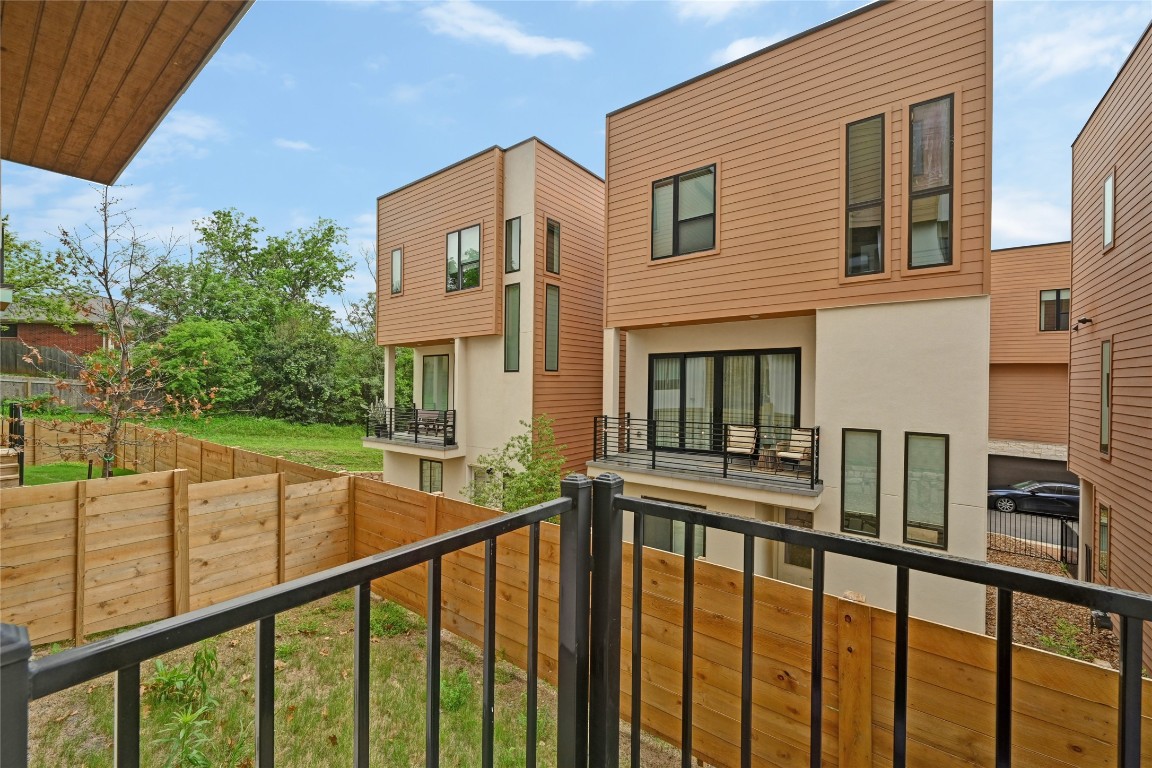 6821 Wolfcreek Pass, Unit 12 Austin, TX 78749 - Photo 30 of 32 a view of a building from a balcony