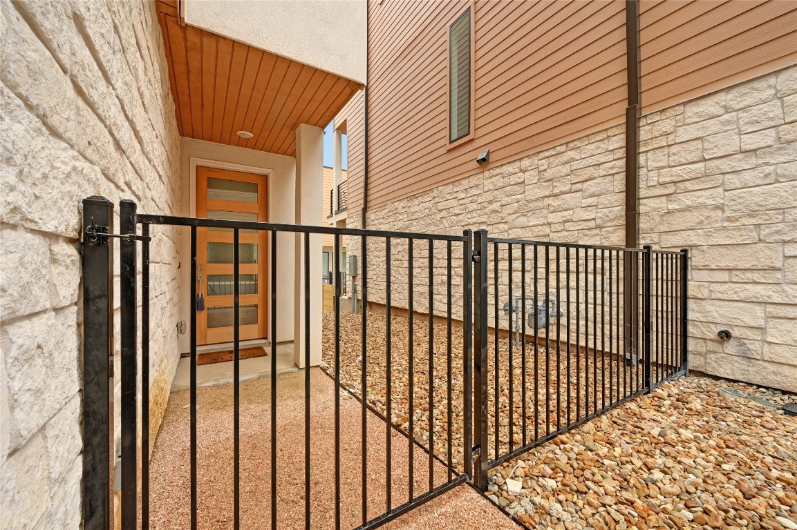 6821 Wolfcreek Pass, Unit 12 Austin, TX 78749 - Photo 3 of 32 a view of a balcony with a door