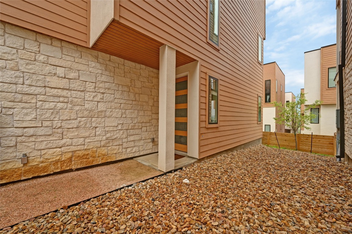 6821 Wolfcreek Pass, Unit 12 Austin, TX 78749 - Photo 4 of 32 a view of a house with a backyard