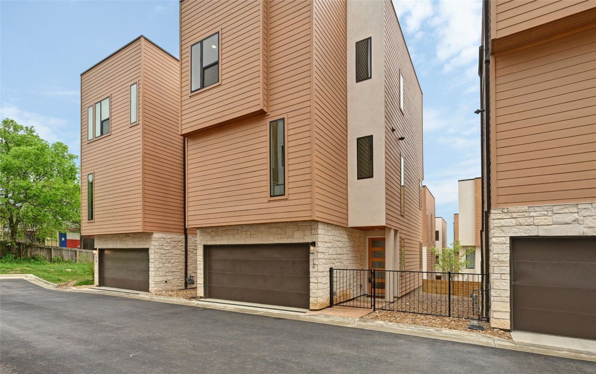 6821 Wolfcreek Pass, Unit 12 Austin, TX 78749 - Photo 6 of 32 a view of a house with a garage