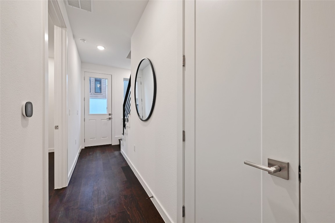 6821 Wolfcreek Pass, Unit 12 Austin, TX 78749 - Photo 7 of 32 a view of a room with wooden floor and entryway
