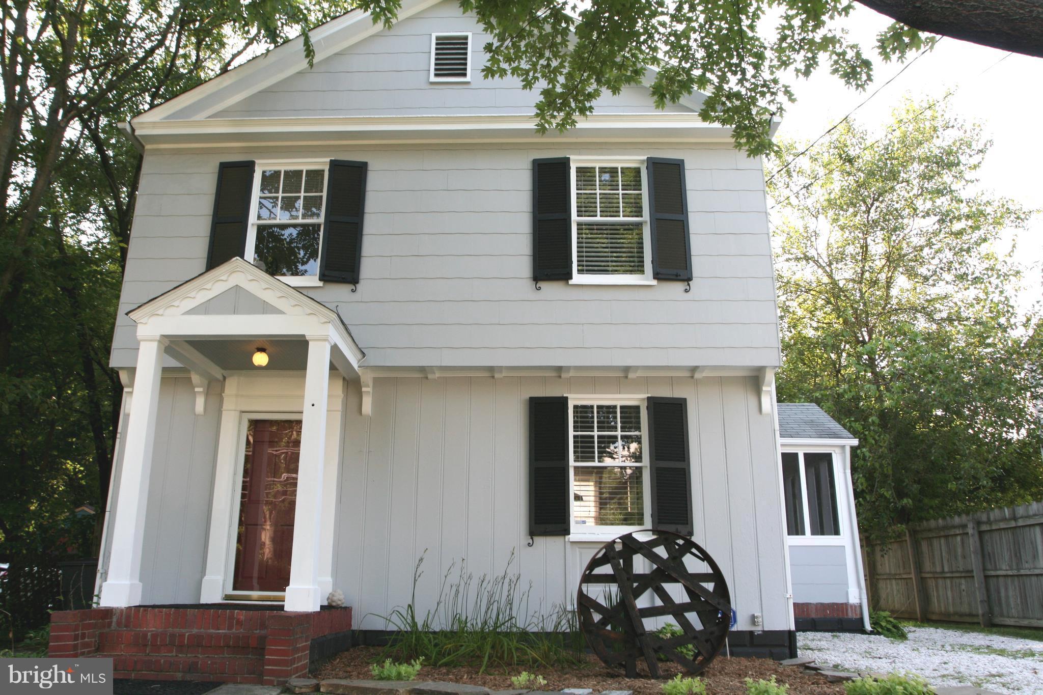 1804 Bay Ridge Avenue Annapolis, MD 21403 - Photo 1 of 26 a front view of a house with garden