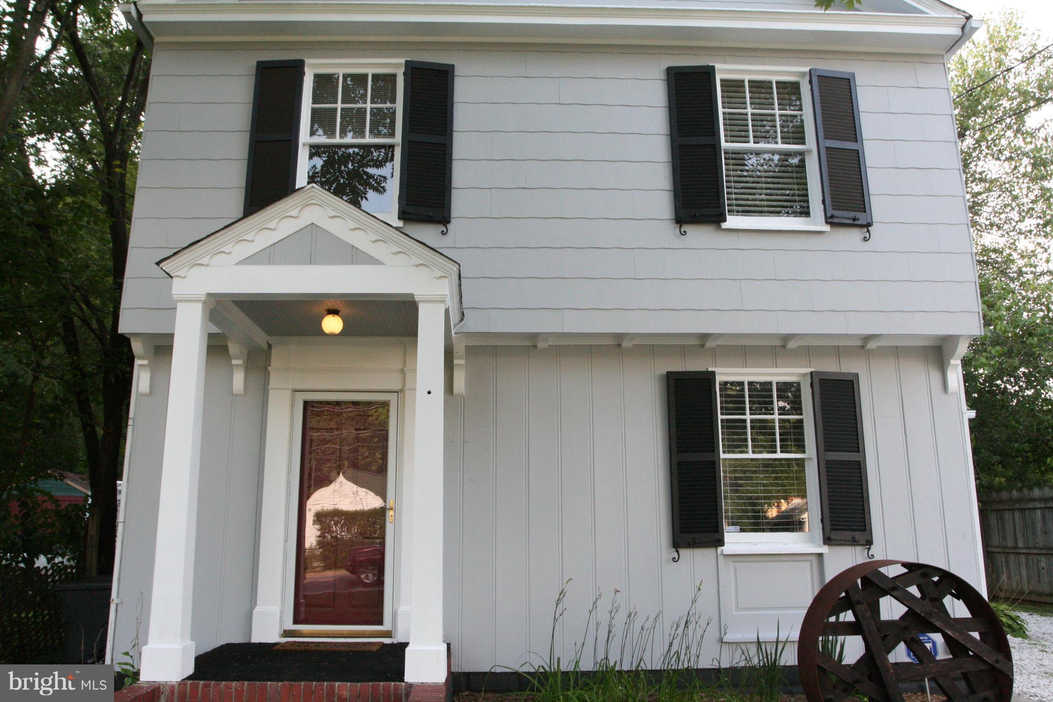 1804 Bay Ridge Avenue Annapolis, MD 21403 - Photo 2 of 26 a front view of a house with a yard