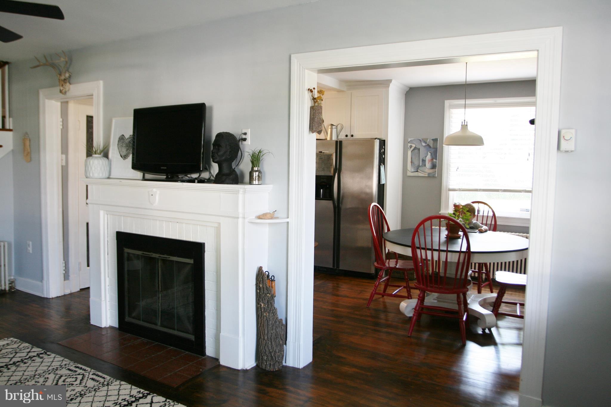 1804 Bay Ridge Avenue Annapolis, MD 21403 - Photo 11 of 26 a living room with furniture a fireplace and a flat screen tv