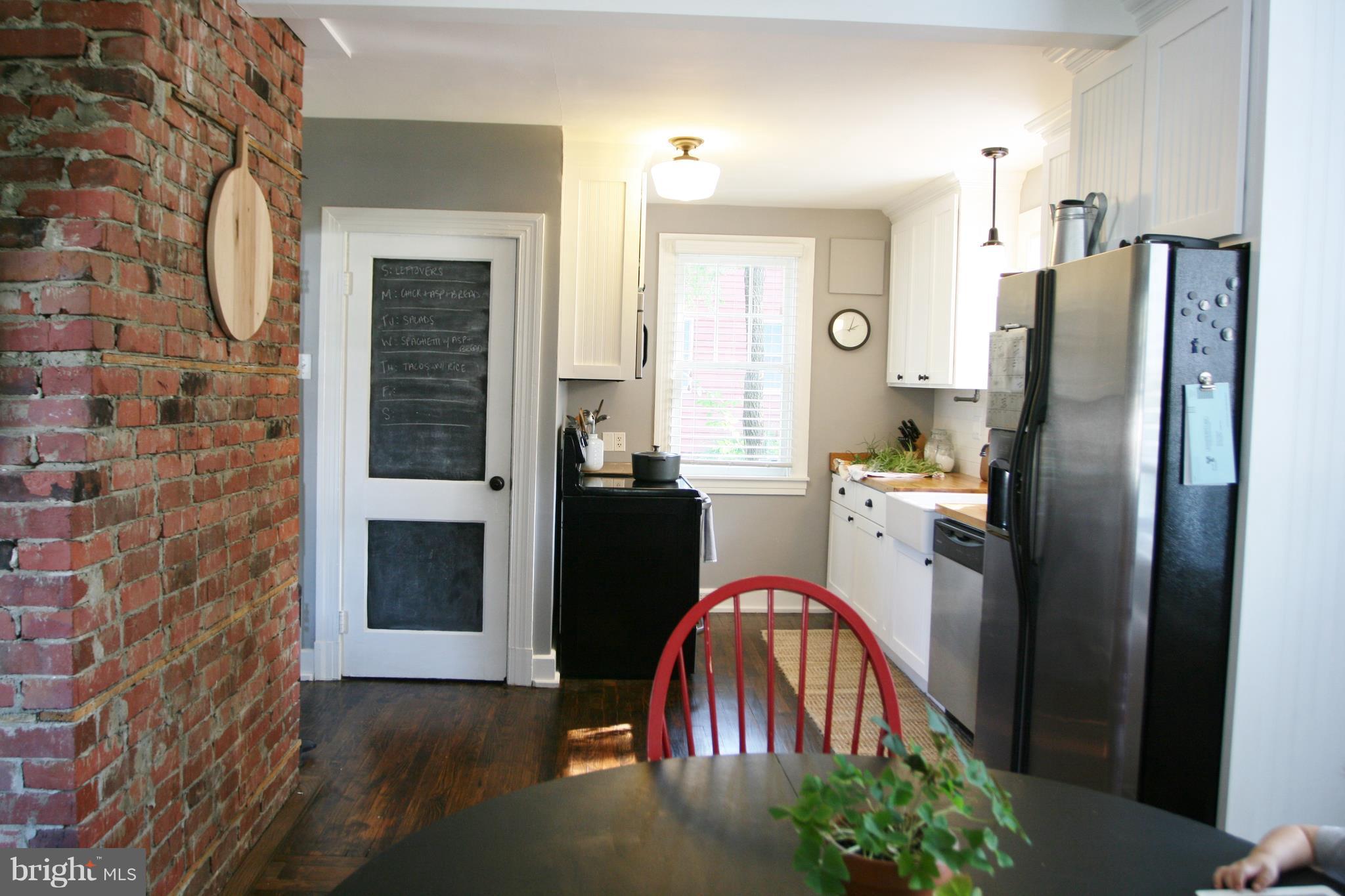 1804 Bay Ridge Avenue Annapolis, MD 21403 - Photo 12 of 26 a kitchen with stainless steel appliances a refrigerator and a stove top oven