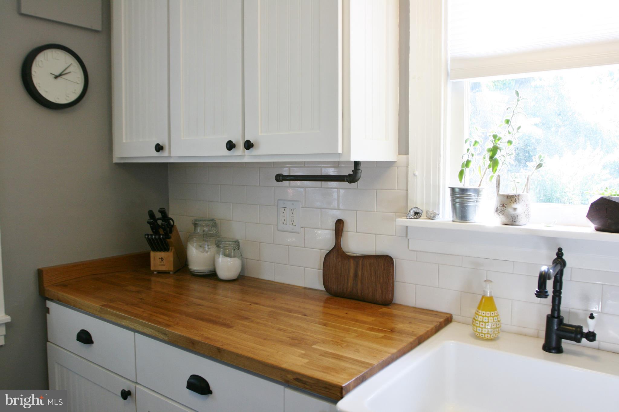 1804 Bay Ridge Avenue Annapolis, MD 21403 - Photo 14 of 26 a kitchen with a sink and cabinets