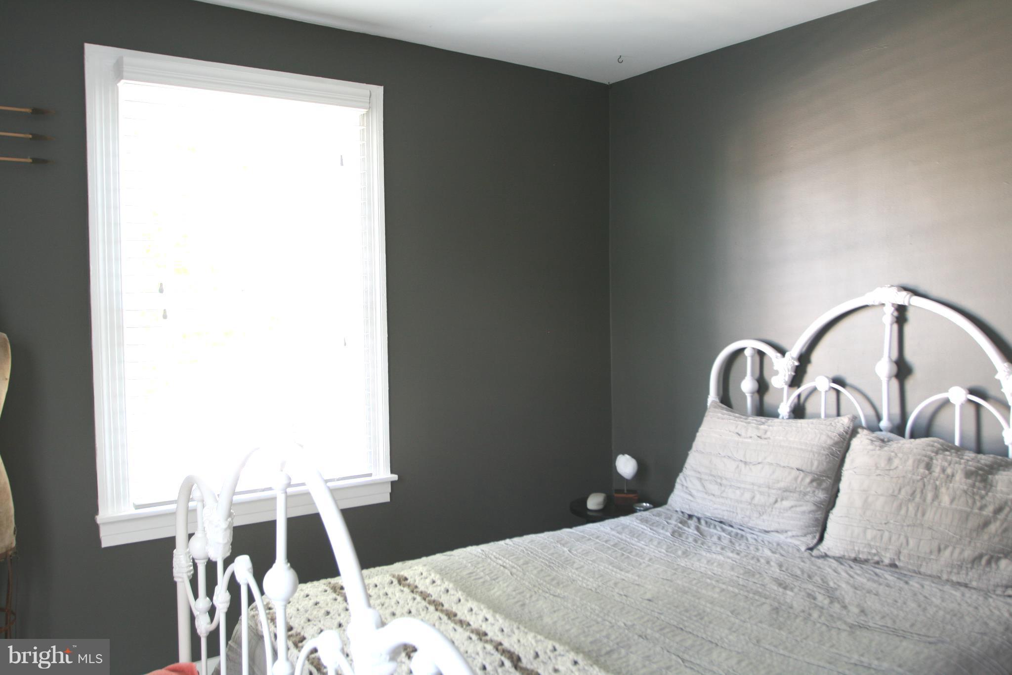 1804 Bay Ridge Avenue Annapolis, MD 21403 - Photo 25 of 26 a bedroom with a bed and a window