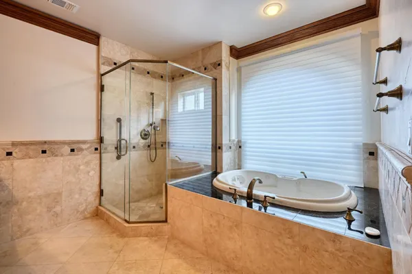 a kitchen with stainless steel appliances granite countertop a stove and a wooden floor