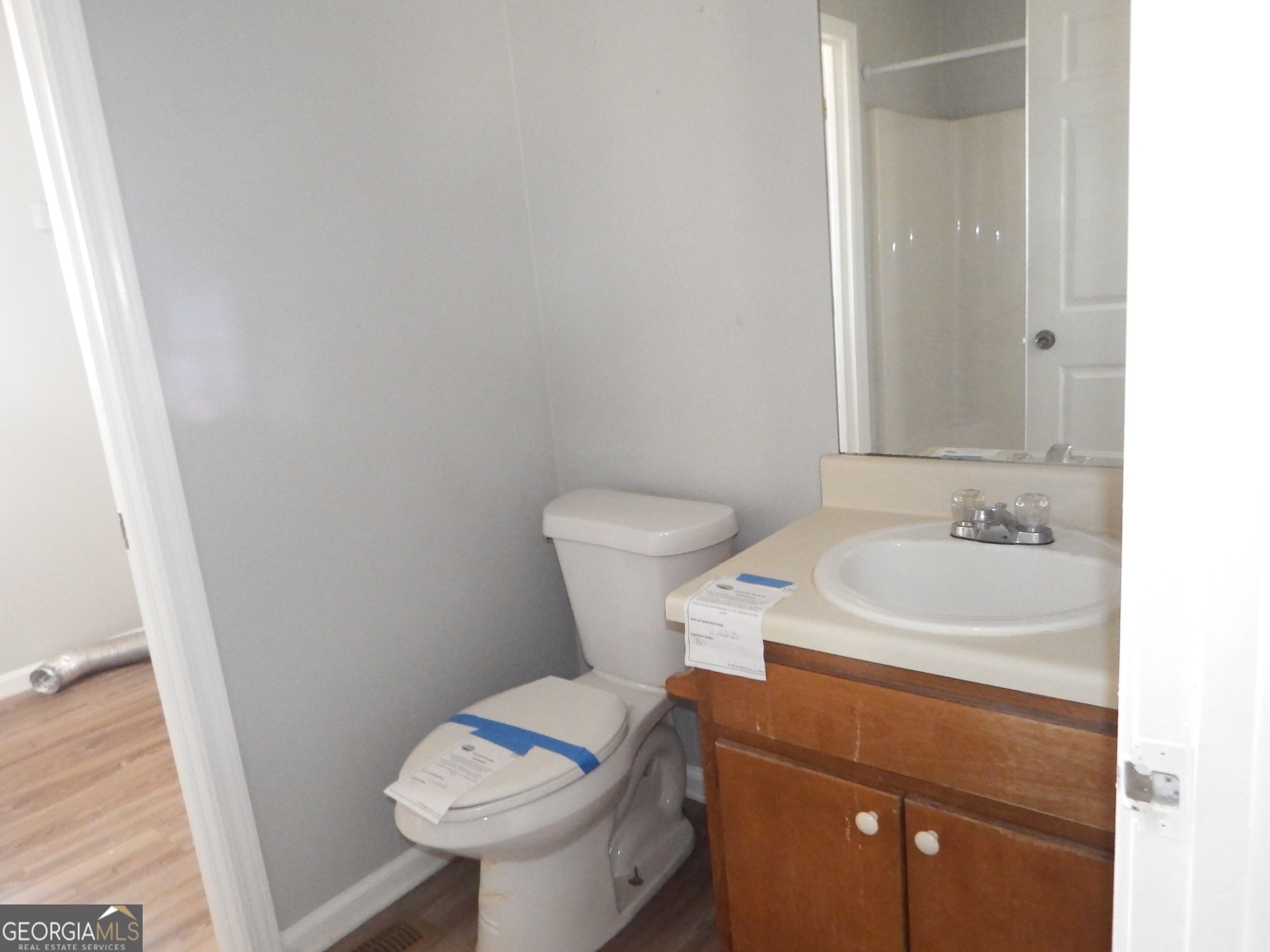 2780 Highpoint Road Snellville, GA 30078 - Photo 8 of 12 a bathroom with a sink and a toilet