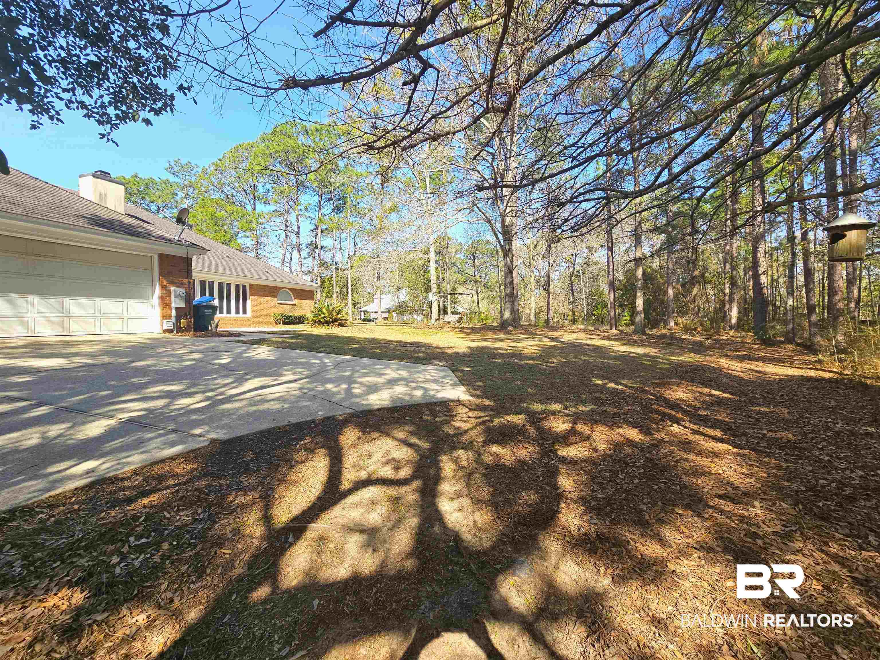 7425 Blakeley Ridge Drive Daphne, AL 36527 - Photo 31 of 31 View of yard with concrete driveway and an attached garage