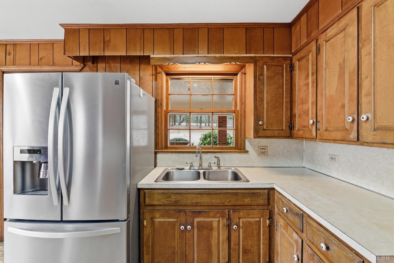 1730 Redfields Road Appomattox, VA 24522 - Photo 14 of 53 a kitchen with stainless steel appliances granite countertop a refrigerator and a sink