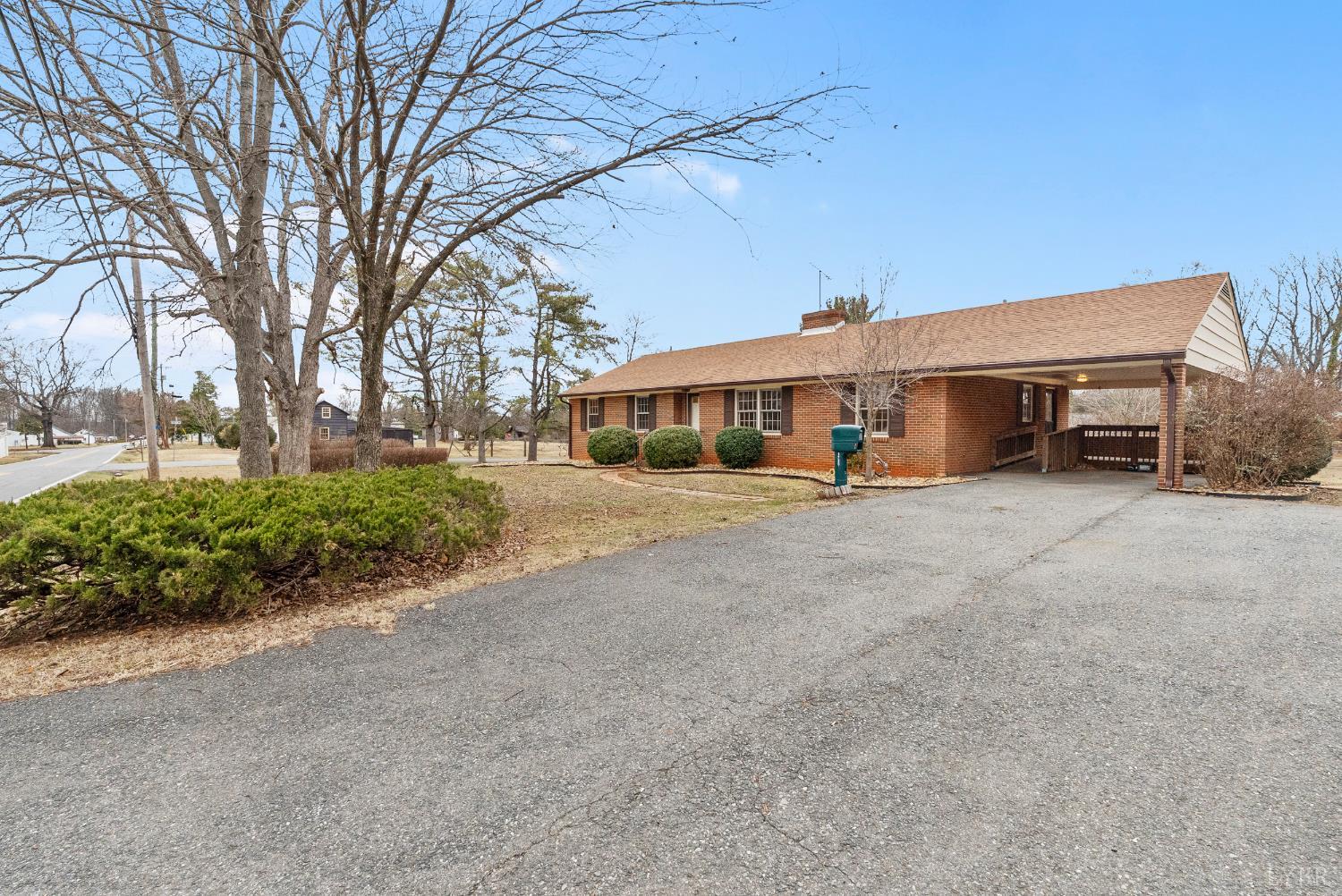 1730 Redfields Road Appomattox, VA 24522 - Photo 3 of 53 a view of a house with a large trees