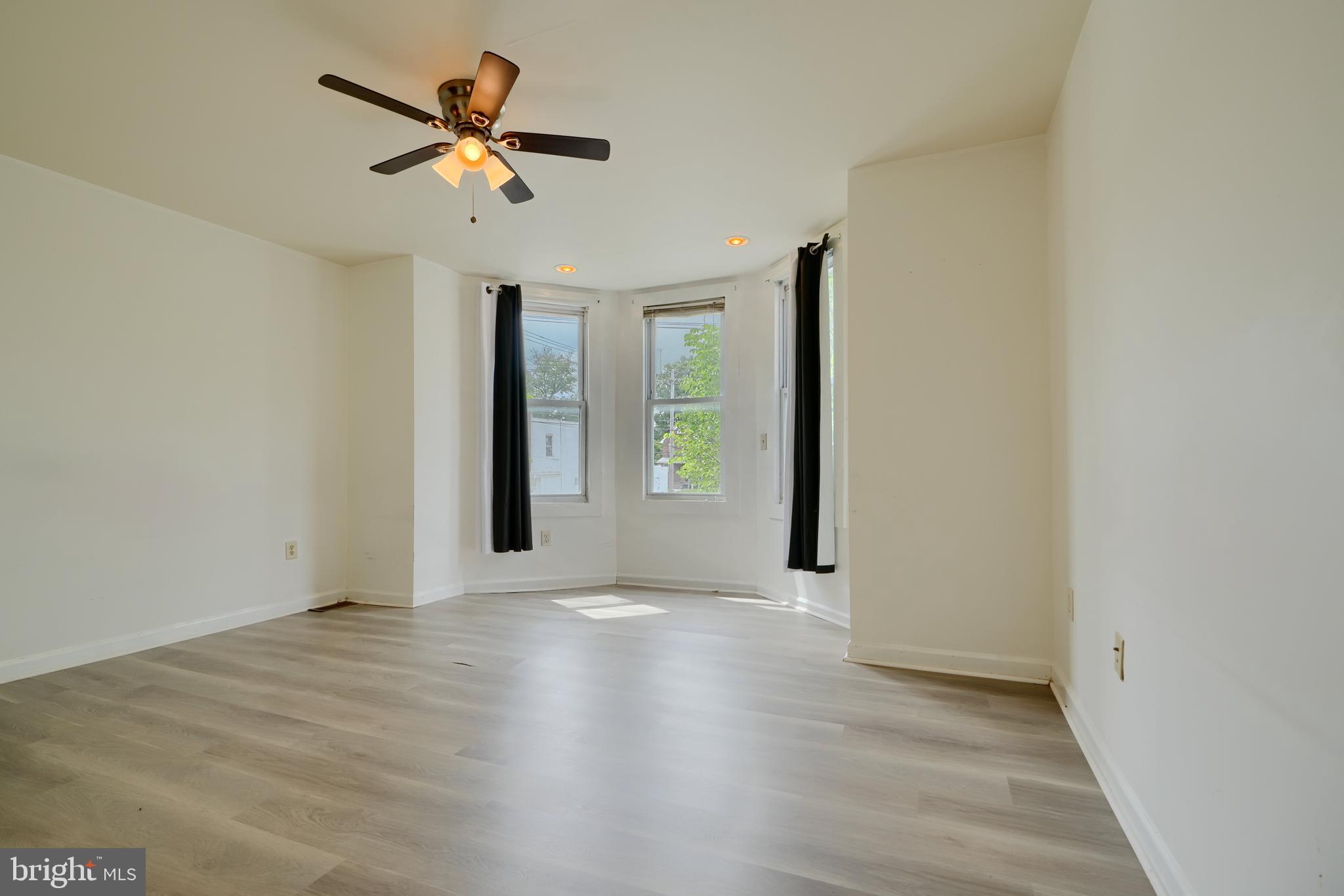 2251 Annapolis Road Baltimore, MD 21230 - Photo 11 of 13 an empty room with fan and a ceiling fan