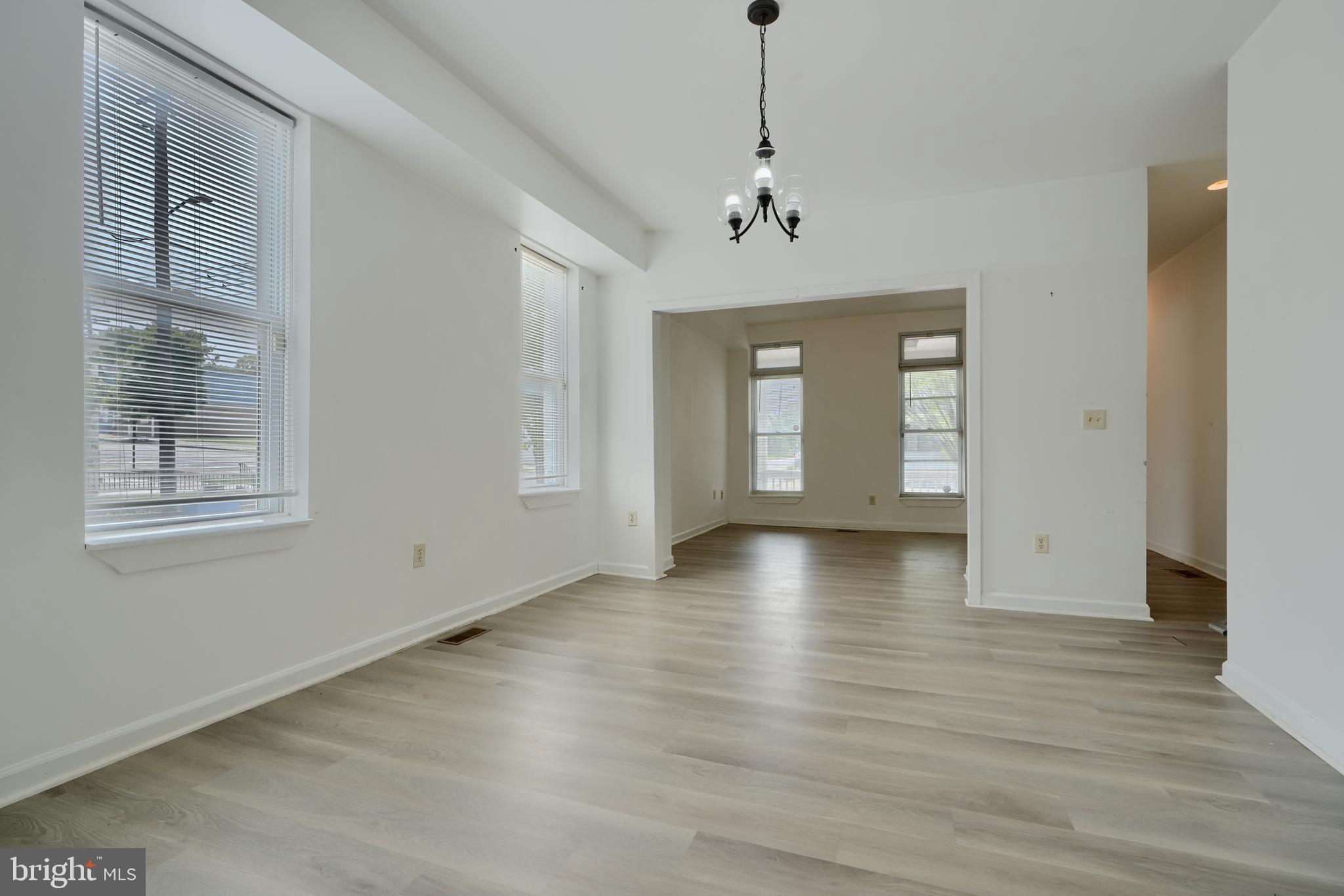 2251 Annapolis Road Baltimore, MD 21230 - Photo 2 of 13 a view of empty room with wooden floor and fan