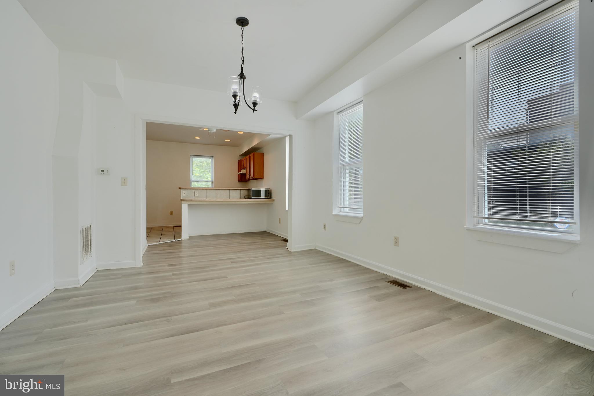 2251 Annapolis Road Baltimore, MD 21230 - Photo 4 of 13 a view of a livingroom with a chandelier