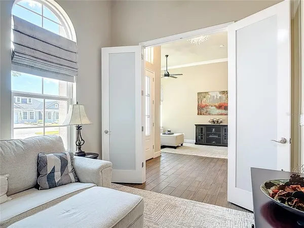 a bedroom with a large bed and flat tv