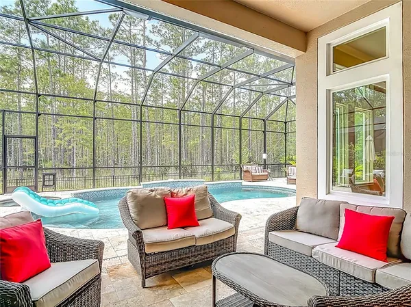 a view of swimming pool with seating space