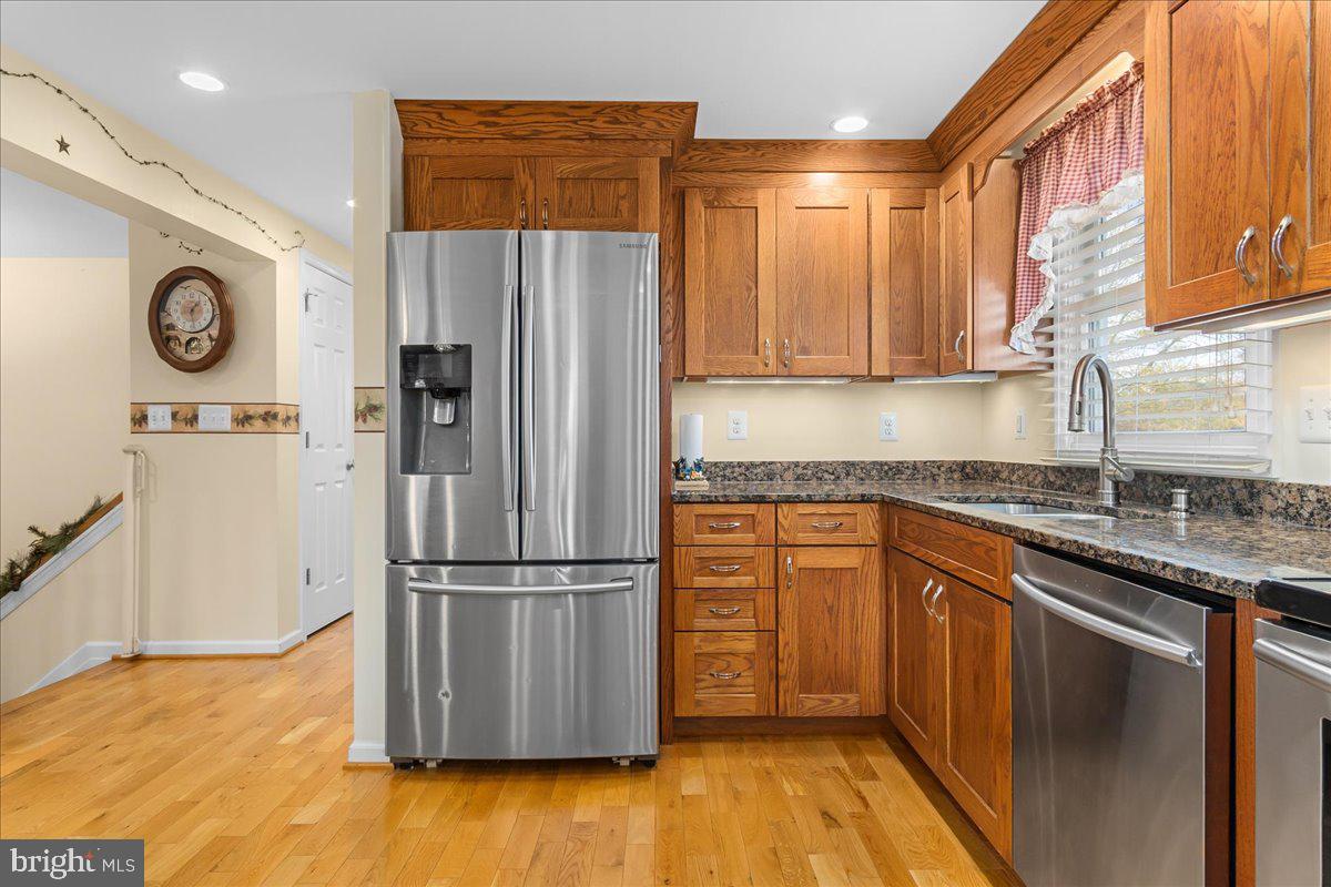 11701 Walnut Point Road Hagerstown, MD 21740 - Photo 19 of 56 a kitchen with a refrigerator sink and cabinets