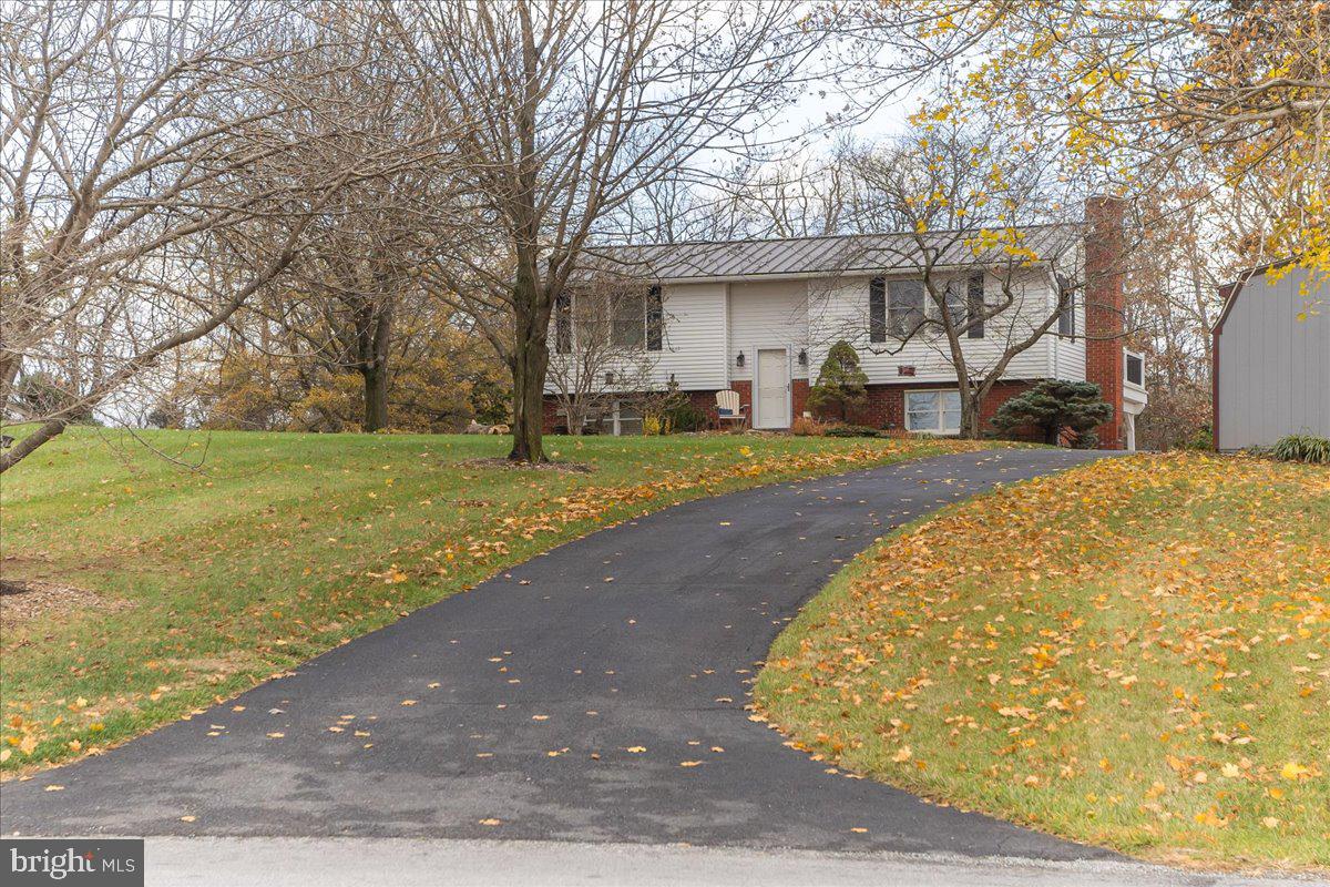 11701 Walnut Point Road Hagerstown, MD 21740 - Photo 2 of 56 a view of a house with a yard and an outdoor space