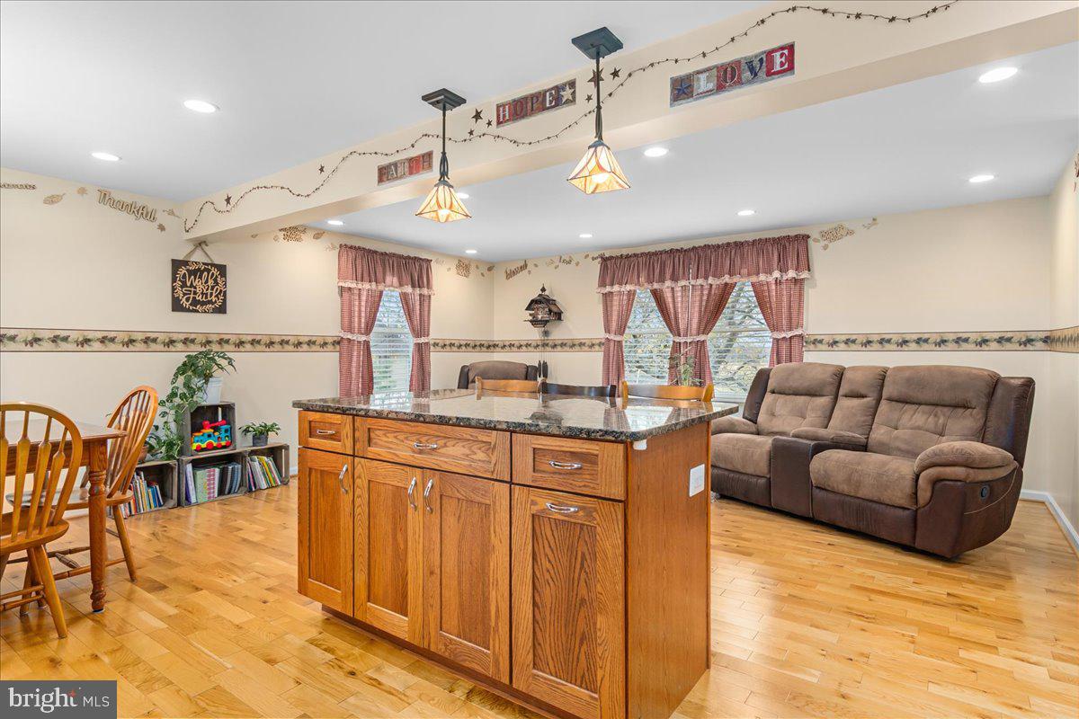 11701 Walnut Point Road Hagerstown, MD 21740 - Photo 21 of 56 a kitchen with stainless steel appliances granite countertop a sink and cabinets