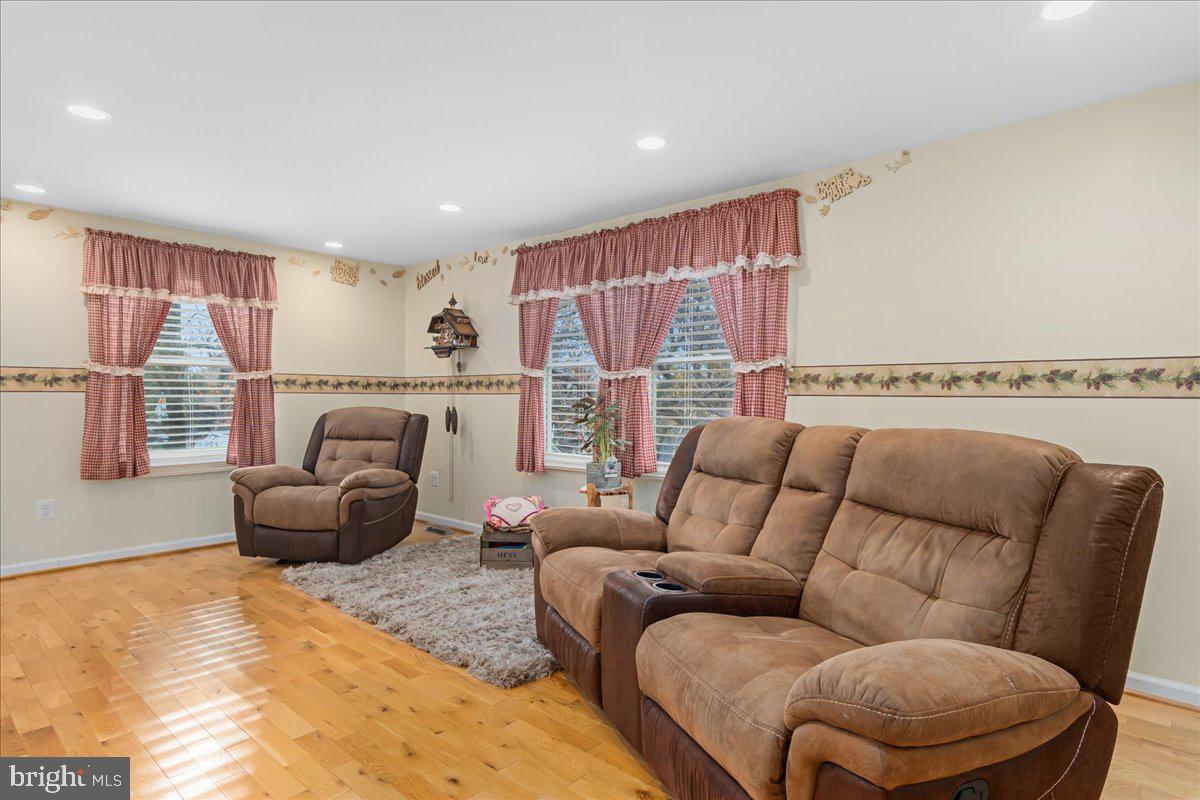 11701 Walnut Point Road Hagerstown, MD 21740 - Photo 24 of 56 a living room with furniture a large window and a couch