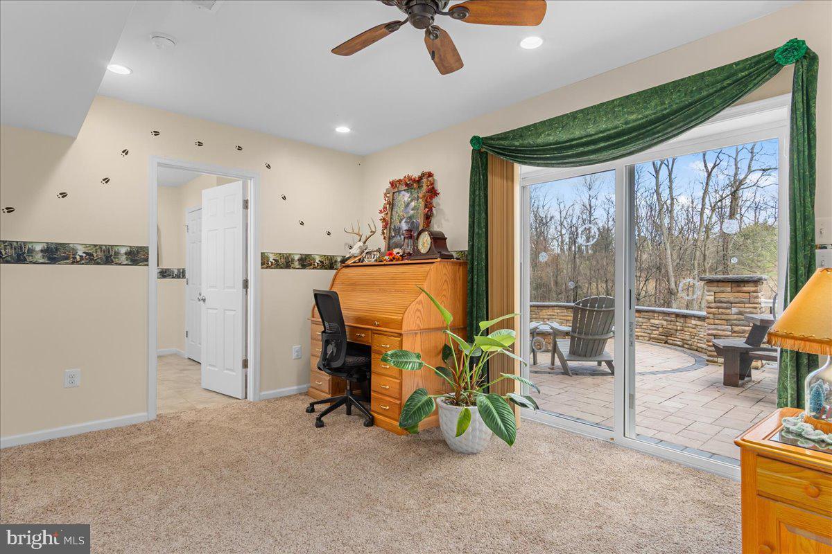 11701 Walnut Point Road Hagerstown, MD 21740 - Photo 32 of 56 a view of a livingroom with furniture and a floor to ceiling window