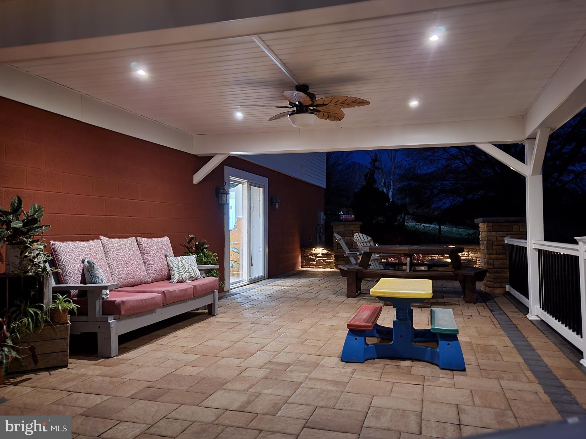 11701 Walnut Point Road Hagerstown, MD 21740 - Photo 55 of 56 a living room with furniture gym equipment and a table