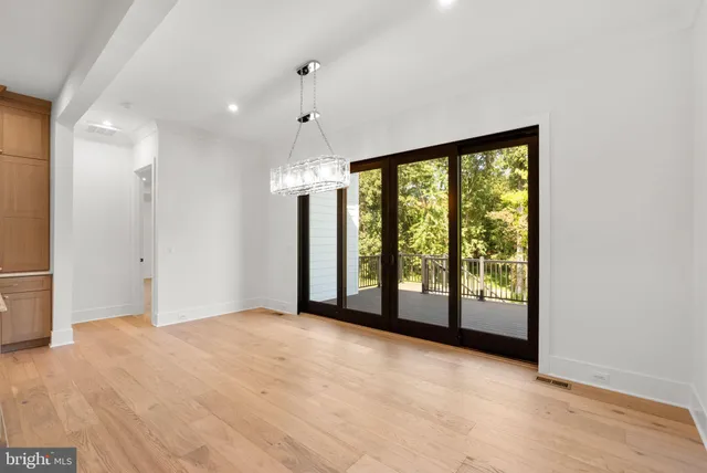 an empty room with windows and outdoor view