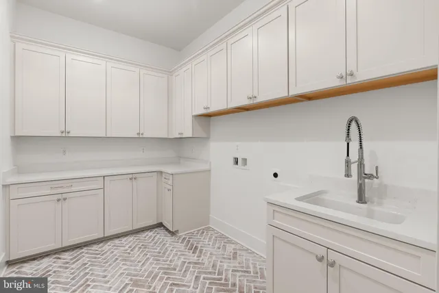 a view of a room with wooden floor and windows