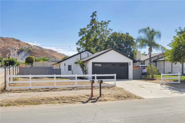 a house that has a tree in front of it