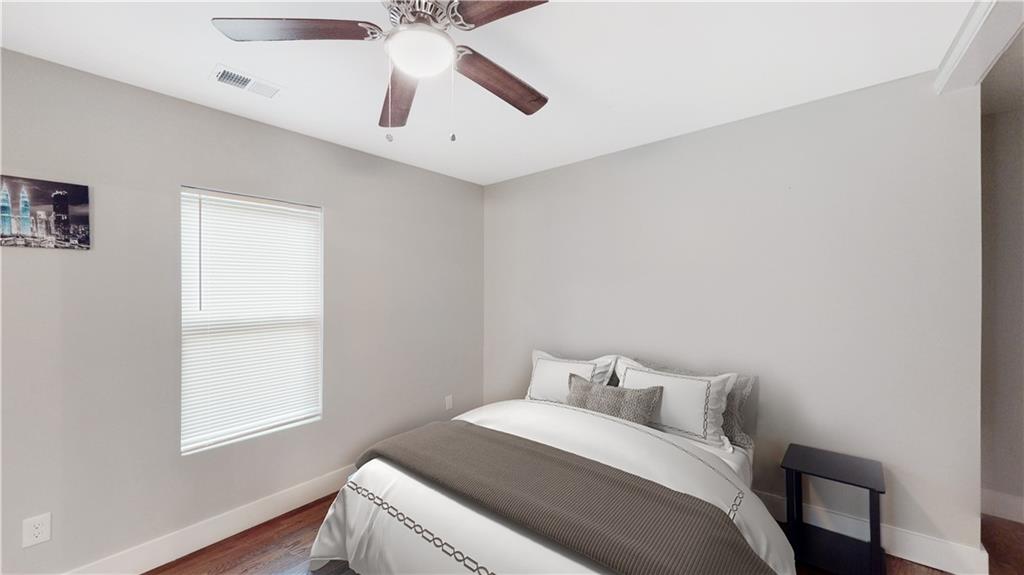 1333 Campbellton Road Southwest Atlanta, GA 30310 - Photo 21 of 21 a bedroom with a bed and a window