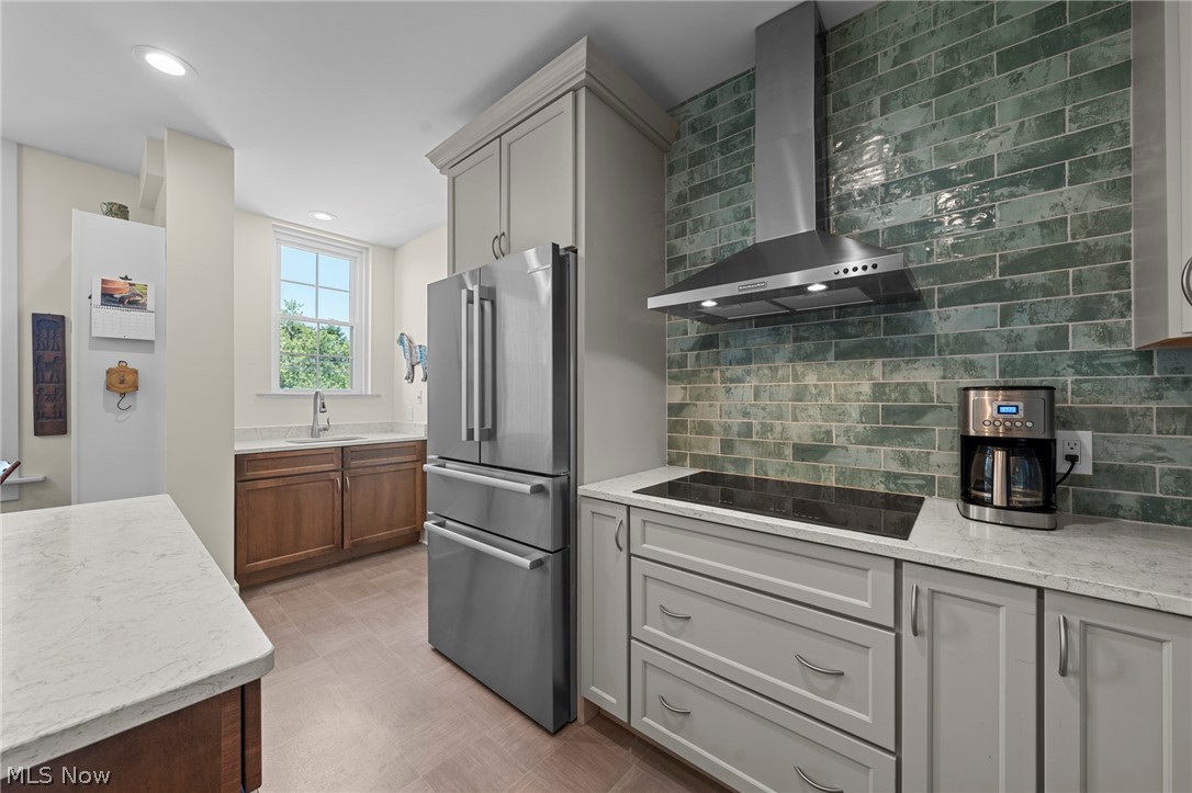 12546 Cedar Road, Unit 4 Cleveland Heights, OH 44106 - Photo 18 of 43 Newer windows, gourmet Kitchen taken down to the studs with center island and breakfast bar, 2 sinks, quartz counters, all Bosch stainless appliances with induction range and 2 ovens for large gatherings
