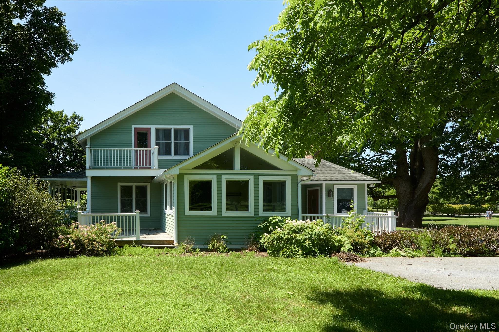 2039 Salt Point Turnpike Salt Point, NY 12578 - Photo 12 of 45 Rear view of property featuring covered porch, a yard, and a balcony