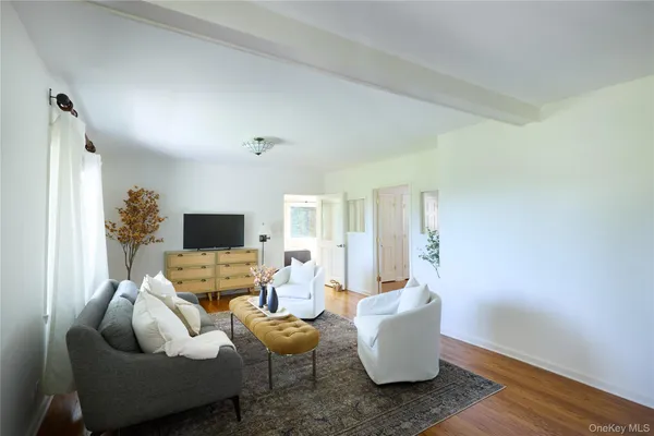 a bedroom with a bed and a television