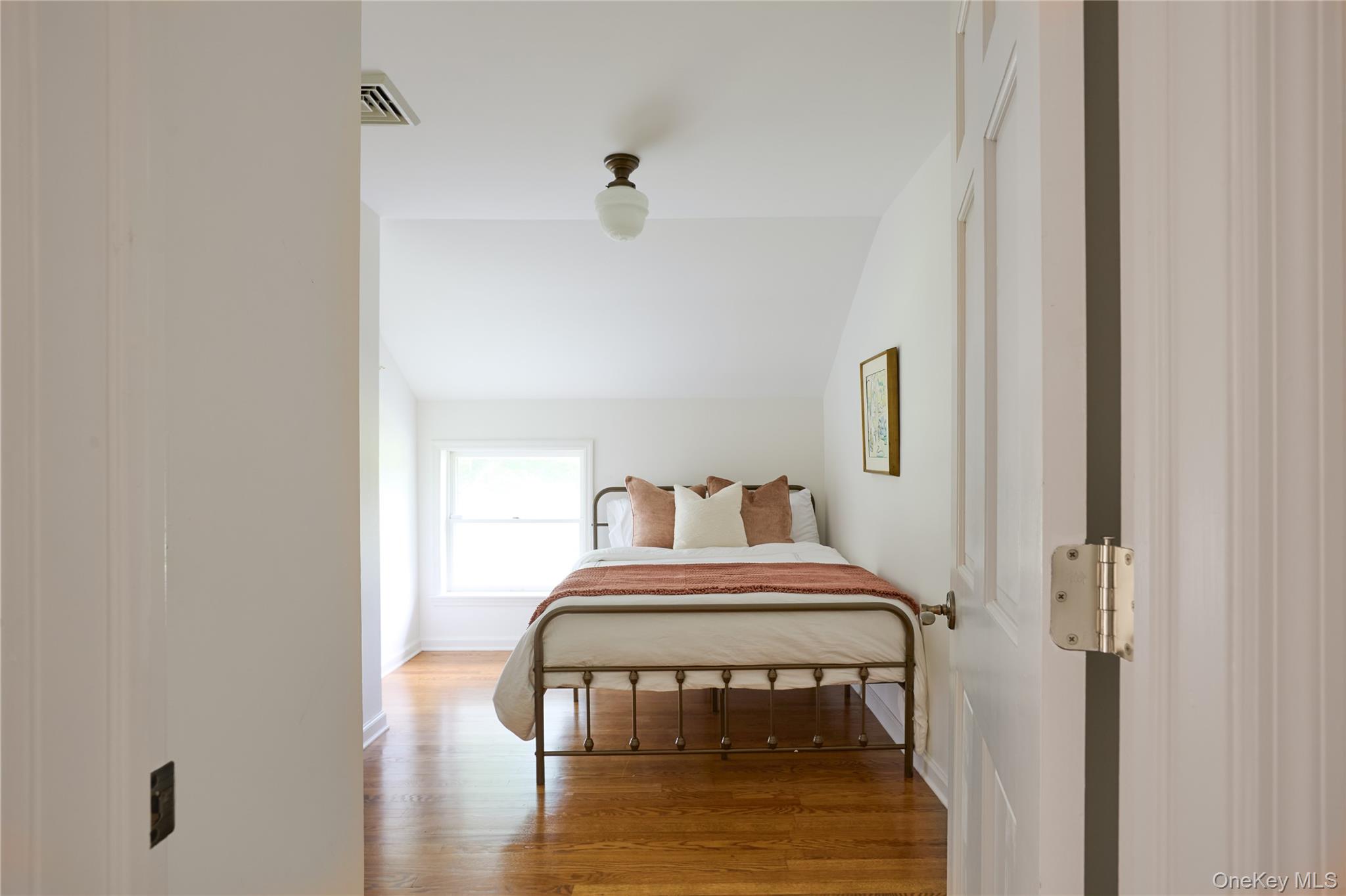 2039 Salt Point Turnpike Salt Point, NY 12578 - Photo 25 of 45 Bedroom featuring wood finished floors and vaulted ceiling